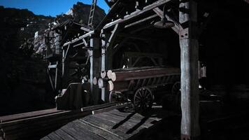 CGI Historic mining structures and wooden carts in rocky dusk video