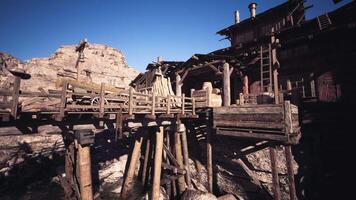 CGI Old wooden dock structure near rocky terrain in bright daylight setting video