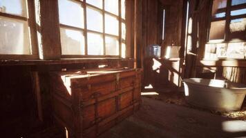 CGI Sunlight streaming through dusty windows in a rustic wooden room with a bathtub video
