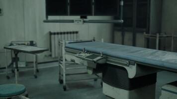 CGI Abandoned hospital interior with a deserted examination table in dim lighting video