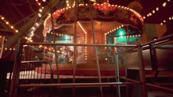 CGI Empty amusement park with colorful lights and a carousel at night video