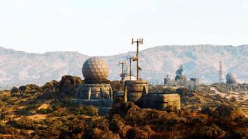 CGI Military base situated in mountainous terrain with communication equipment video
