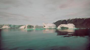 CGI Iceberg formations floating in calm waters at dawn in Greenland fjords video
