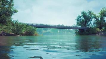 CGI Calm river landscape featuring a scenic bridge under cloudy skies video