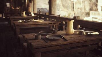 CGI Rustic dining setup with wooden tables and utensils in a serene setting video
