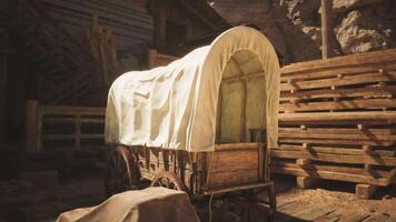 CGI Wooden wagon covered with canvas situated inside a rustic barn setting video
