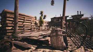CGI Deserted settlement in the wild west featuring weathered barrels and structures video