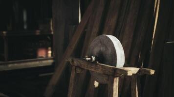 CGI A traditional grinding stone stands in an old workshop during the day video