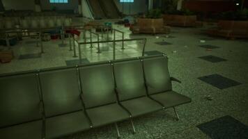 CGI Exploring an abandoned airport terminal with empty seats and scattered debris video