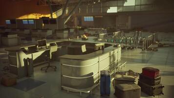 CGI Abandoned airport check in counter with scattered luggage in fading light video