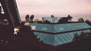 CGI Modern design with angular glass rooftops in a tranquil setting video