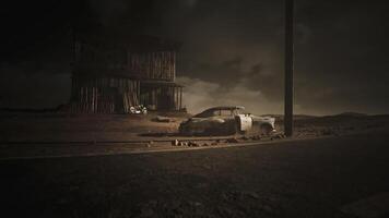 CGI Abandoned car near a dilapidated building in a barren landscape at dusk video