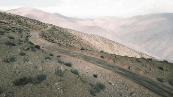 CGI Winding mountain road through the Pamir Mountains in Tajikistan at sunset video