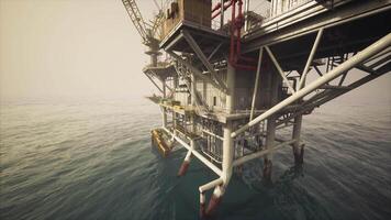 CGI Old oil platform in calm waters surrounded by misty atmosphere at dusk video