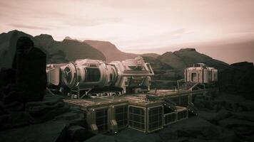 CGI Colonist base situated on a distant planet amidst rocky terrain at sunset video