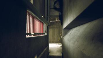 CGI Exploring a dark concrete corridor in an industrial building with ambient light video