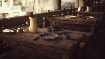 CGI Rustic wooden tables set for communal dining in a coastal seaside setting video