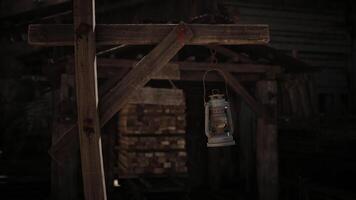 CGI Rustic lantern hanging outside a weathered wooden structure at dusk video