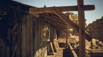 CGI Rustic lantern hanging near an old wooden structure in a desert landscape video