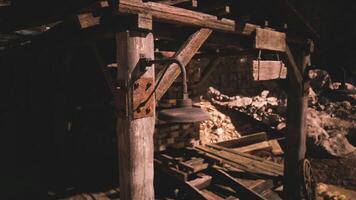 CGI Old wooden structure with a lantern in a dimly lit mining area video