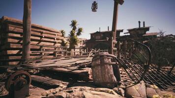 CGI Deserted wooden town with rustic structures and scattered artifacts in sunlight video