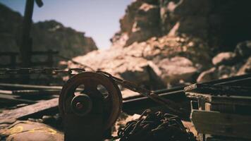 CGI Rustic pulley system in an abandoned mining area under bright sunlight video