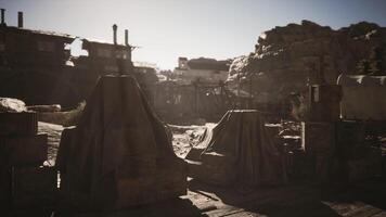 CGI Desolate landscape with covered structures in a dusty settlement at dawn video
