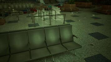 CGI Abandoned airport terminal with empty seating and scattered debris in disrepair video