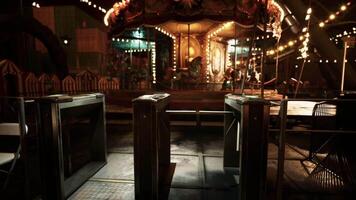 CGI Empty amusement park at night with illuminated rides and deserted entrance video