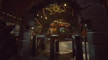 CGI Empty amusement park entrance illuminated by fairy lights at night video