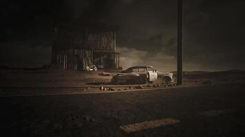CGI Abandoned car near a derelict wooden structure under a dark sky video