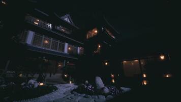 CGI The traditional shogun house illuminated at night in Japan historic district video
