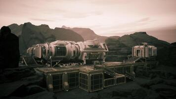 CGI Colonist base on a distant planet with rugged terrain under a hazy sky video