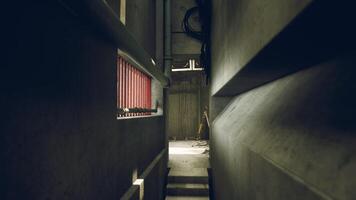 CGI Exploring a dark concrete corridor in an industrial building at midday video