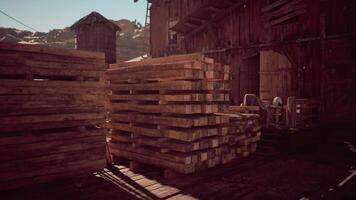 CGI Wooden pallets stacked in an old barn during daytime in a rural setting video