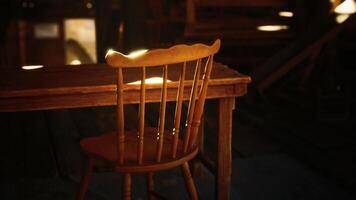 CGI Sunlight casts warm glow on empty wooden chair beside rustic table video