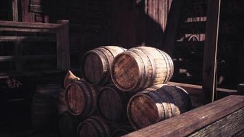 CGI Stacked wooden barrels in a rustic setting during golden hour light video