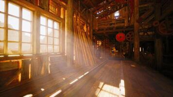 CGI Sunlight streaming through windows in a rustic wooden building interior video