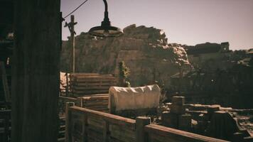 CGI Scenic view of an old western town with wagons and rocky terrain at dusk video