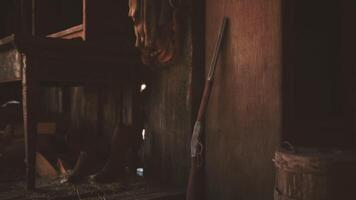 CGI Vintage rifle resting against a wall in a rustic wooden cabin setting video