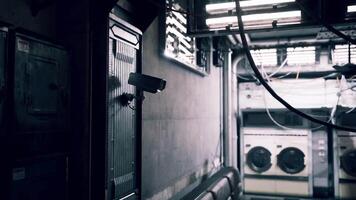 CGI Security camera installation in a dimly lit laundry facility during nighttime video
