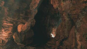 CGI Exploring the breathtaking rock formations inside a cave during daylight video