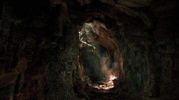 CGI Exploring a mysterious cave with natural light illuminating the rocky walls video