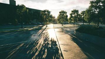 CGI Sunset casting long shadows on a wet city street after a rain shower video