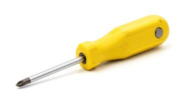 A yellow screwdriver on a white surface photo
