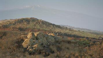 CGI Rugged landscape featuring rocky terrain and distant mountains at sunset video