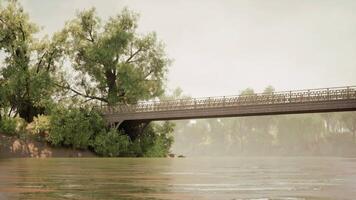 CGI Calm riverbank views featuring a historic bridge surrounded by lush trees video