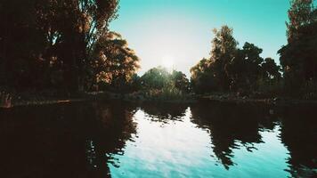 CGI Serene river reflections at sunset with trees lining the bank video