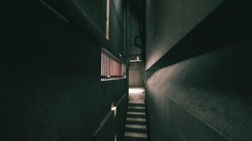 CGI Exploring a shadowy corridor in a dark concrete industrial building video