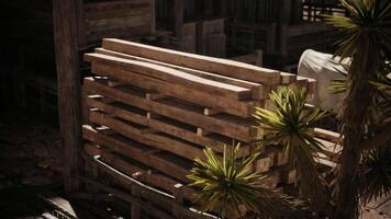 CGI Wooden pallets stacked near greenery in a rustic outdoor setting video